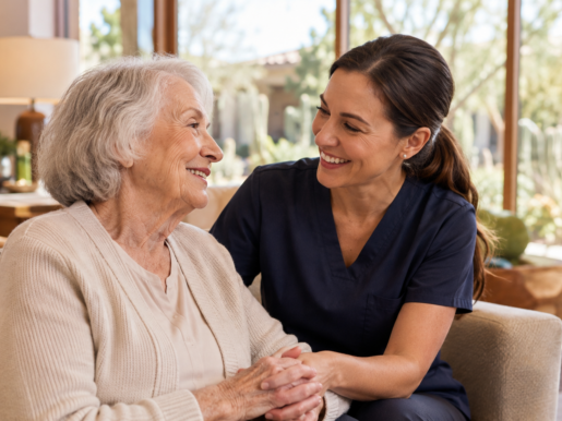 Caregiver sharing a happy moment with a senior woman in a Scottsdale memory care home.